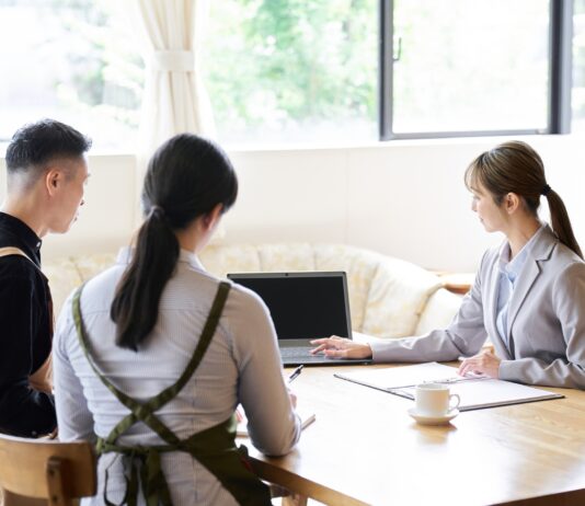 Asian business woman selling to restaurant owners